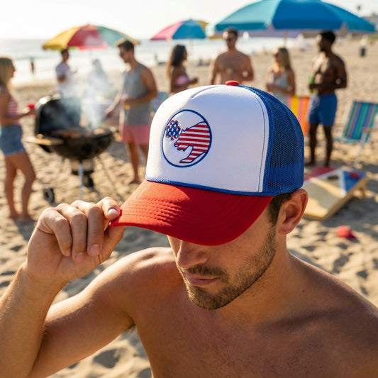 Foam trucker hat with Lucky Bear logo worn by a model adjusting the brim at a lively beach party scene with umbrellas and crowd.