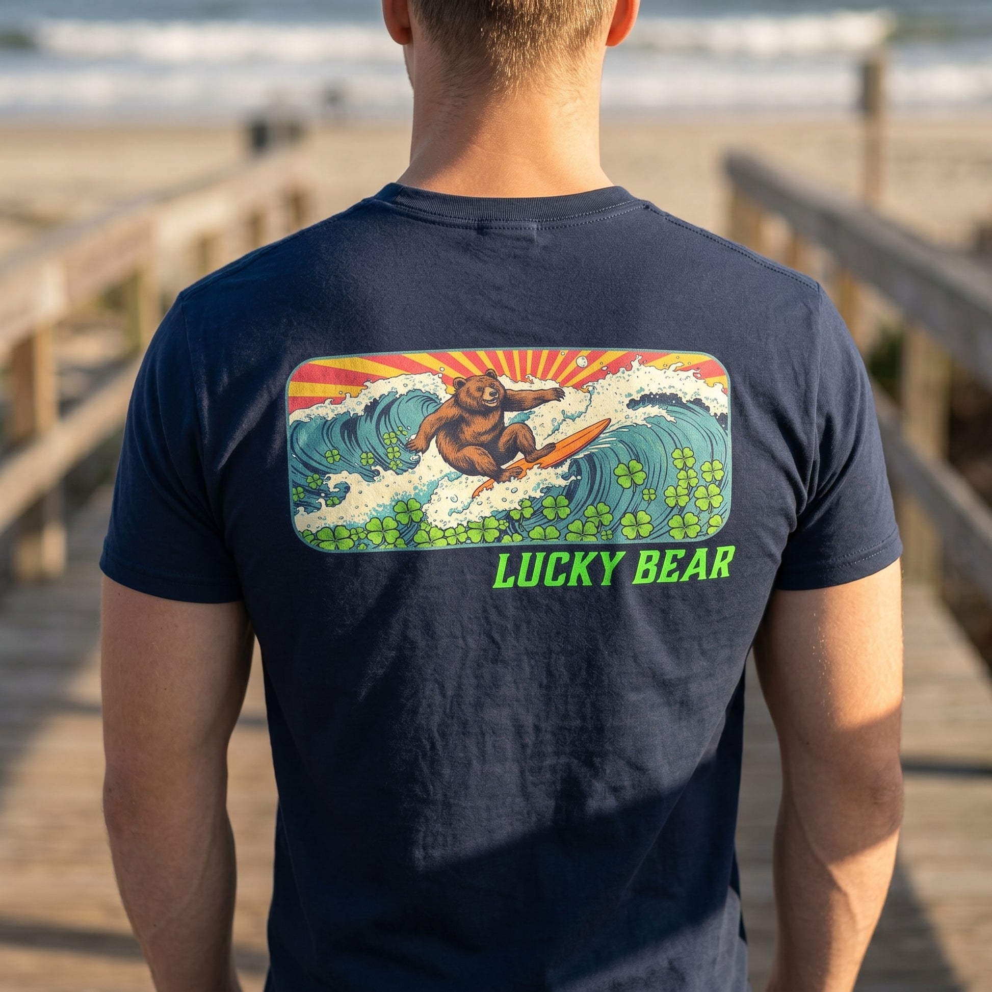 Realistic close-up of Retro Surfing Bear Tee showing textured fabric and vibrant vintage surf print on back.