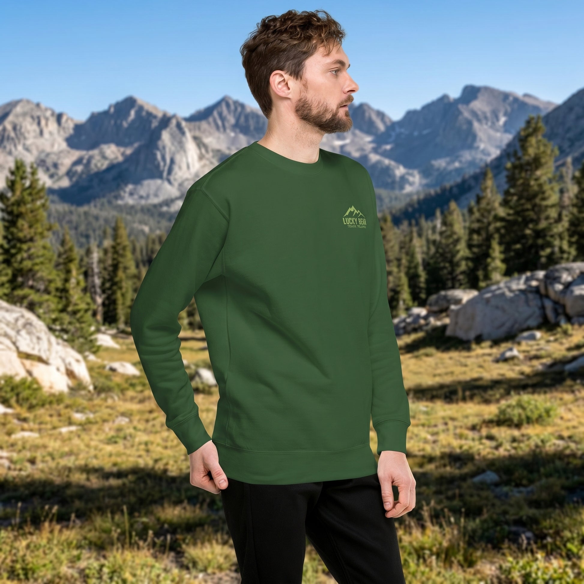 Close-up of Sierra Summit sweatshirt highlighting fleece interior and ribbed neckline with mountain scenery background.
