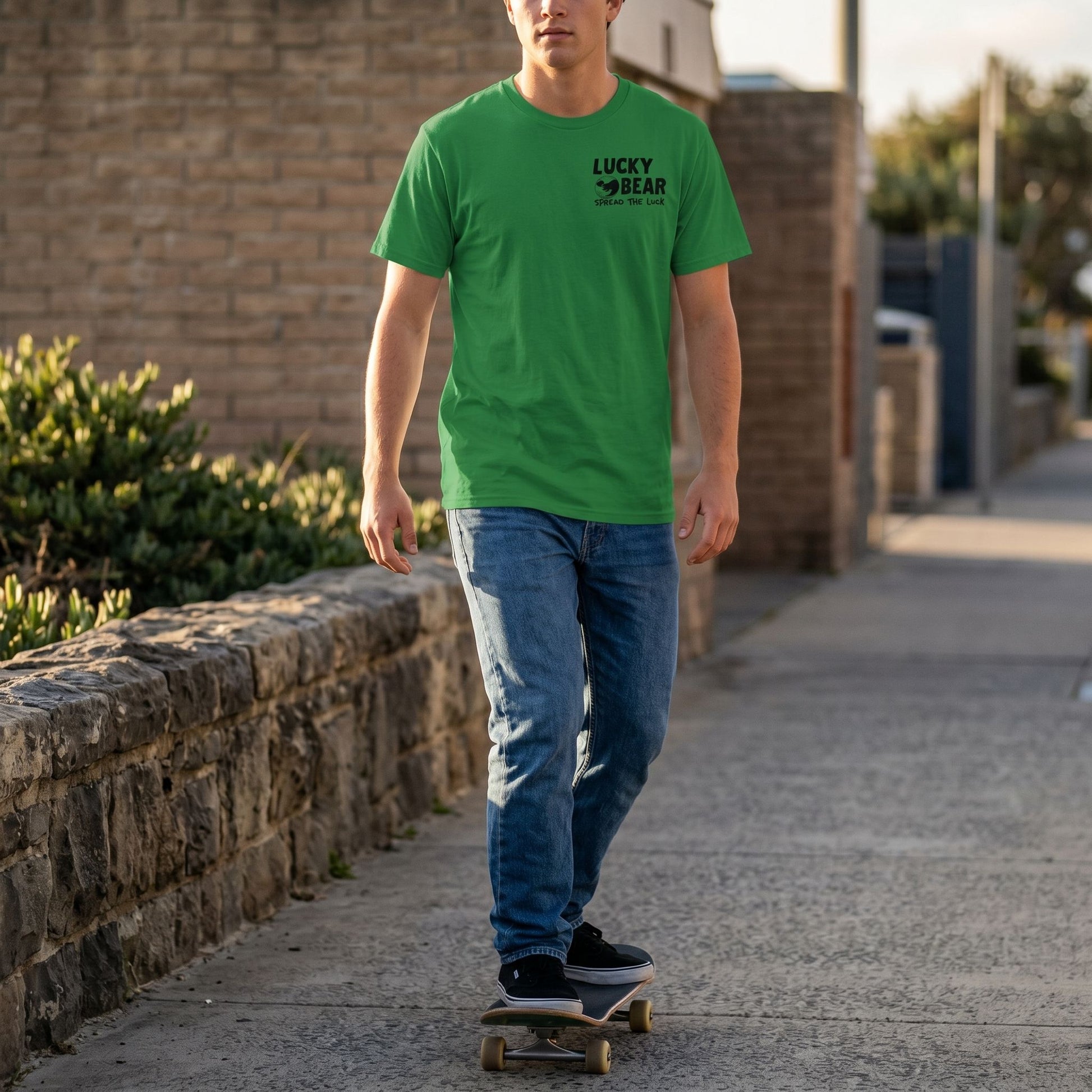 Person skateboarding on a city sidewalk wearing a Spread the Luck classic tee, focusing on the logo and fabric, outdoor setting.