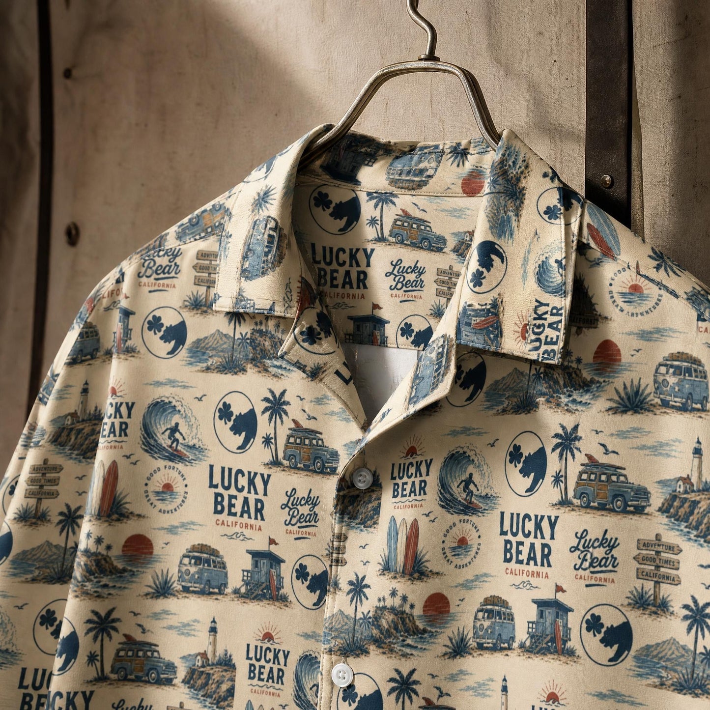 Close-up of the Lucky Bear Americana shirt fabric and print on a vintage hanger with textured background.