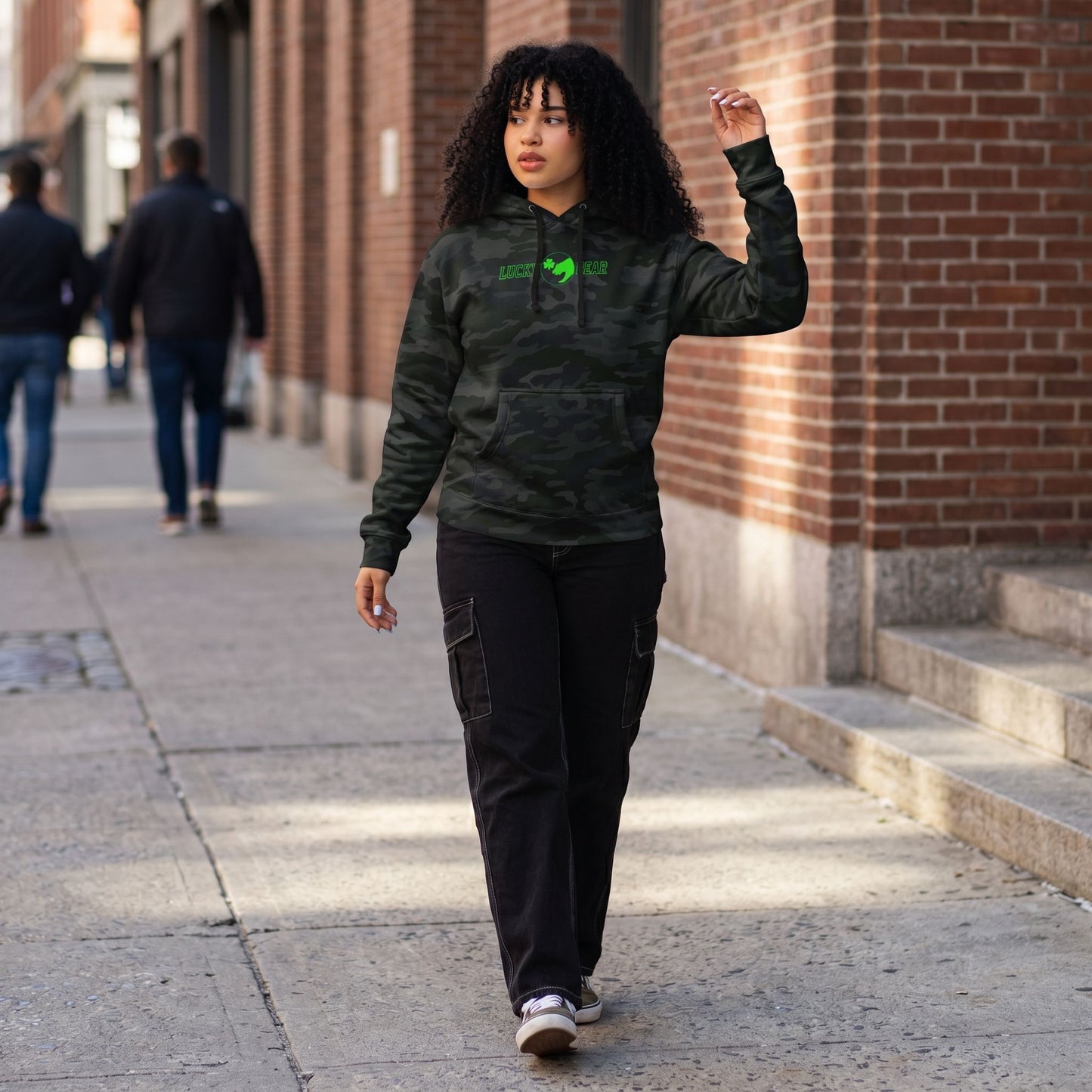 Full-body of a model in the Lucky Bear sweatshirt in an outdoor urban setting, emphasizing relaxed fit and durable fabric.
