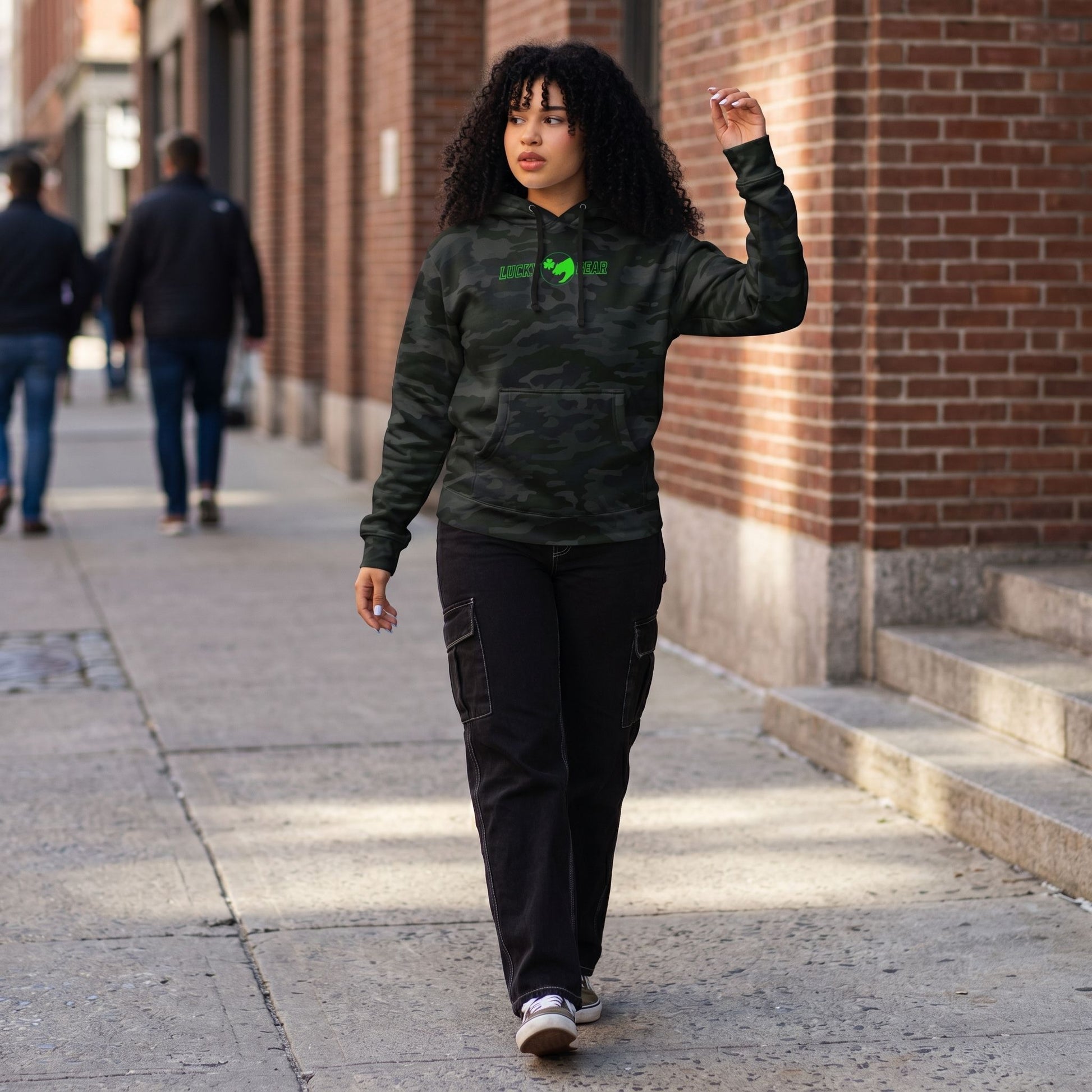 Full-body of a model in the Lucky Bear sweatshirt in an outdoor urban setting, emphasizing relaxed fit and durable fabric.