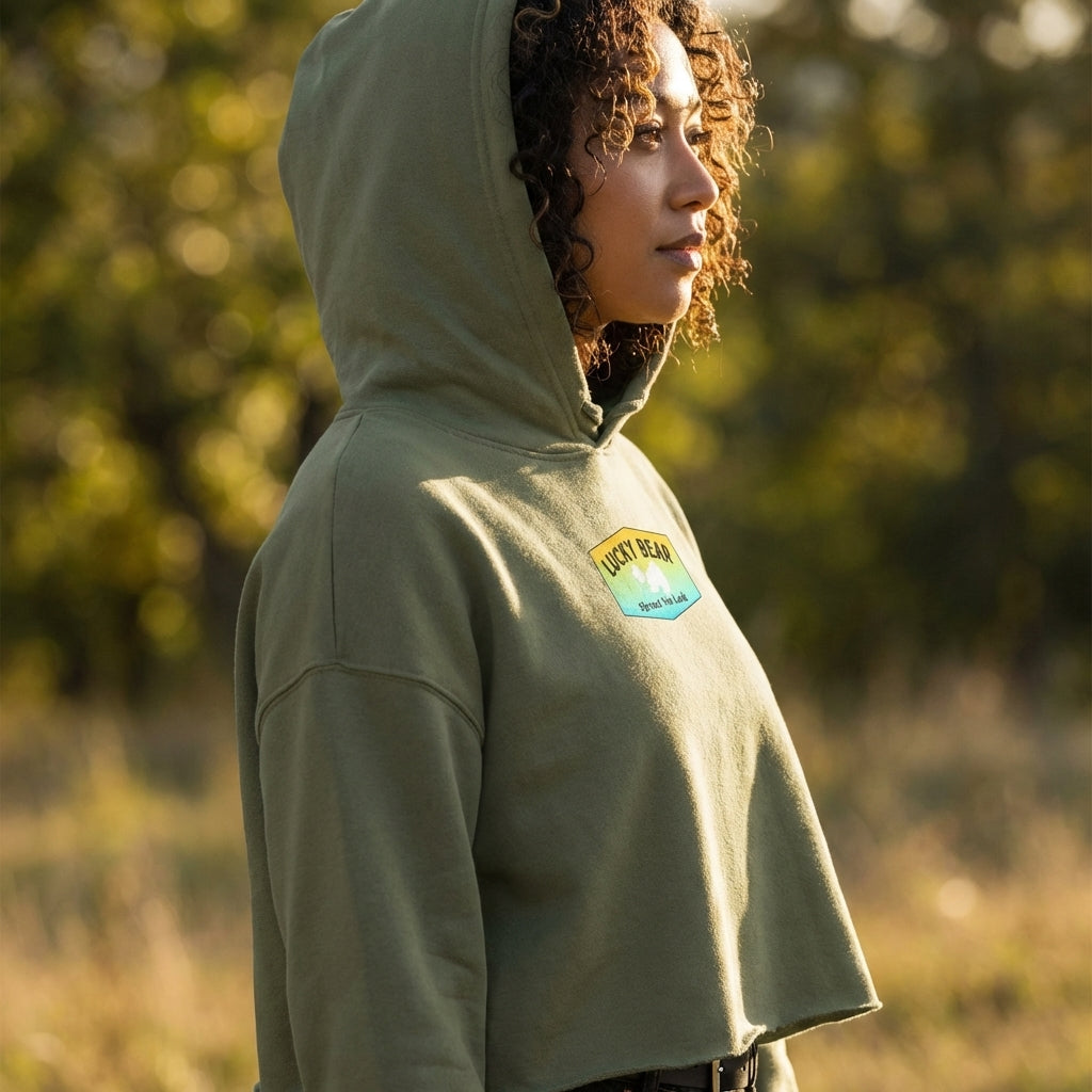 Profile of a model during golden hour wearing Orange Dreaming Crop Hoodie with hood up, focusing on fabric softness and relaxed fit.