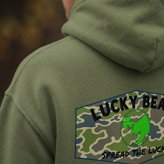 Close-up of the Spread the Luck Stealth Hoodie fabric showing its smooth texture and subtle weave pattern with natural side lighting.
