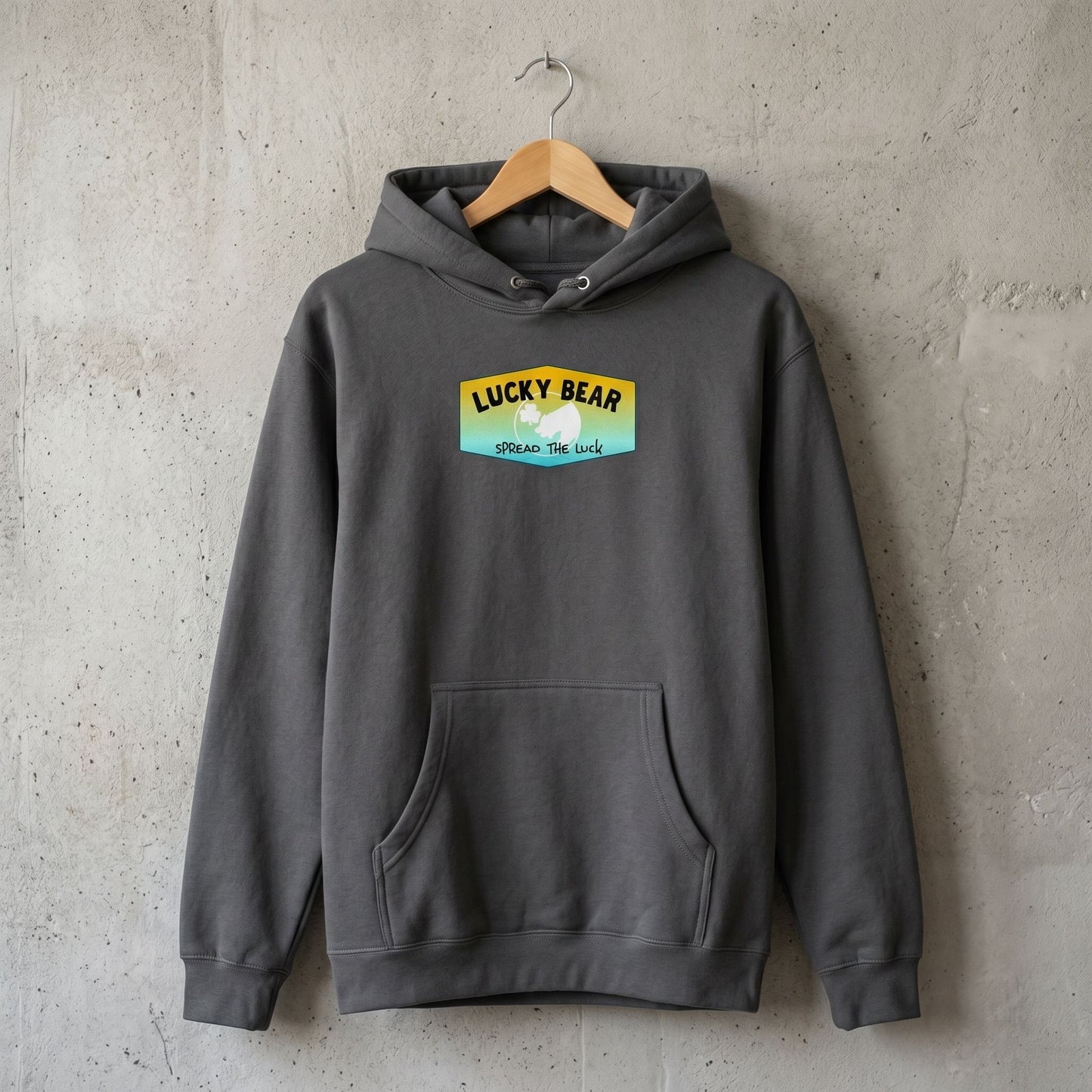 Next, the studio shot features the Summer Sunset Hoodie hanging on a wooden hanger, emphasizing fabric texture and stitching.